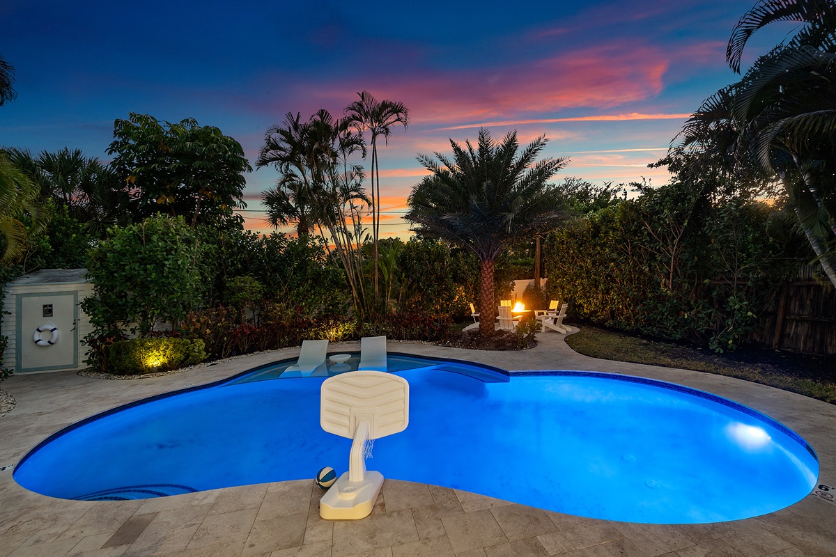 A nighttime oasis. The custom shape and lighting of the pool create a breathtaking, tranquil scene for unforgettable evenings.