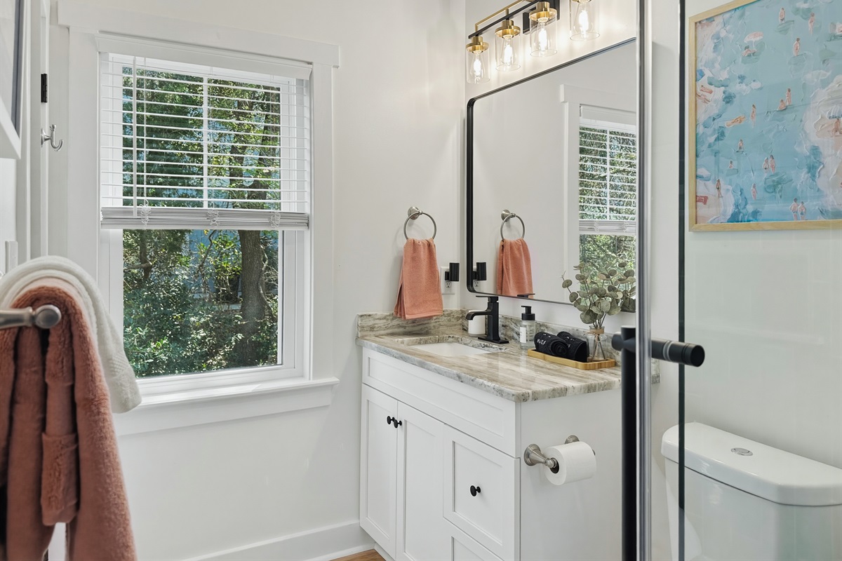 This bathroom has a bright single vanity.