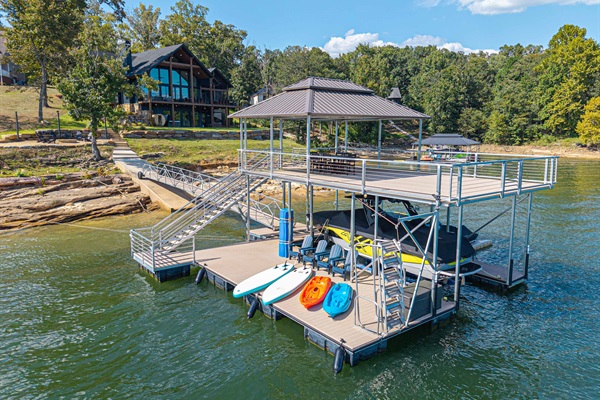 2 Story dock with equipped seating, paddle, boards and canoes. 