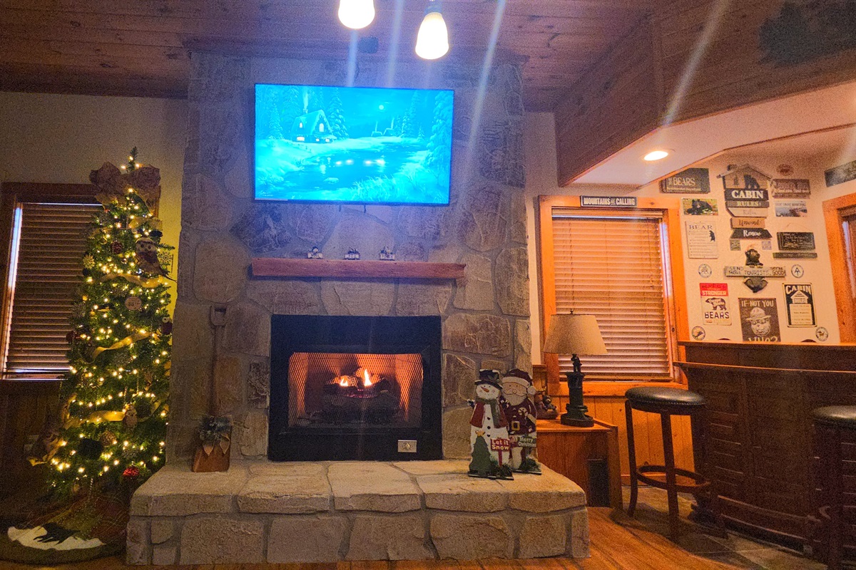 Gas fireplace + 55” Samsung UHD Smart TV for cozy nights in — and we decorate beautifully for the holidays to create an unforgettable mountain experience.
