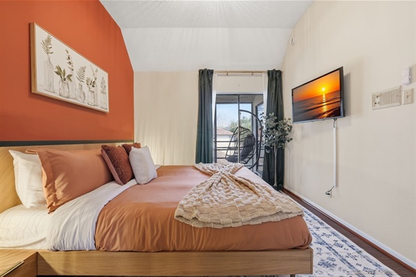 Bedroom with King Bed, 43" TV, closet and Balcony access