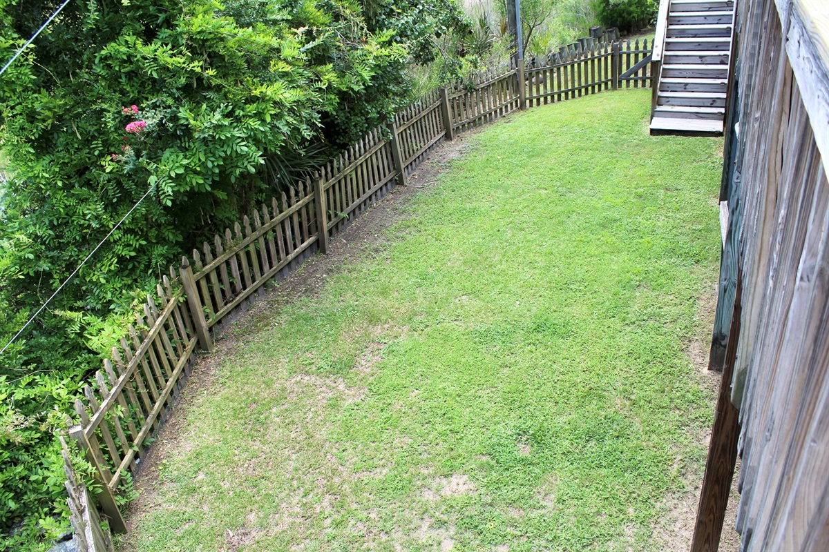 This fully fenced side yard is perfect for your furry friends to roam, romp, and relax.