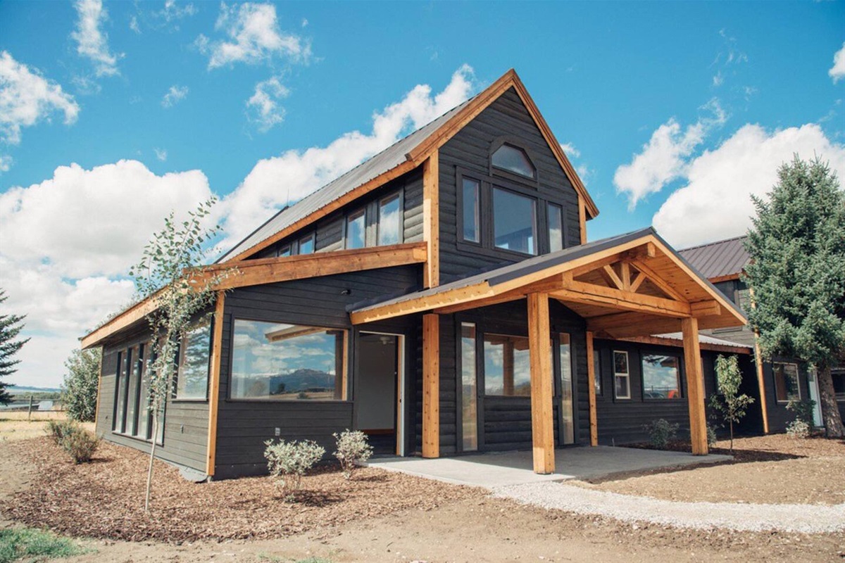 The spacious home features beautiful farmhouse-style architecture.