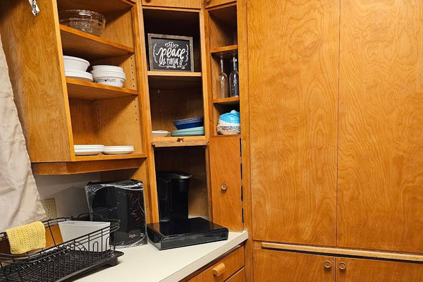 Full kitchen with plates, cups, silverware, pots, pans, and most essentials. Two types of coffee Keurig and drip.