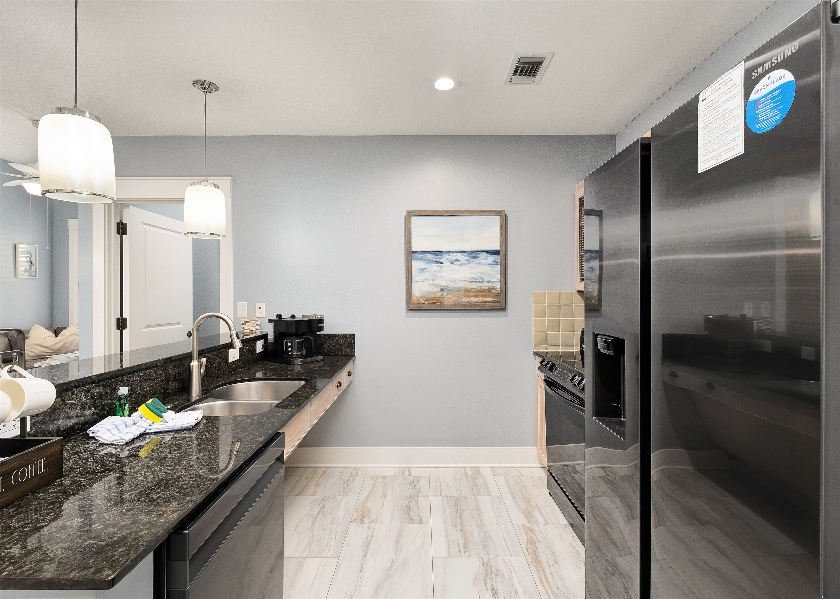 Granite countertops, stainless steel appliances, and stylish pendant lighting make this kitchen as beautiful as it is functional. Everything you need to cook up a delicious meal during your stay.
