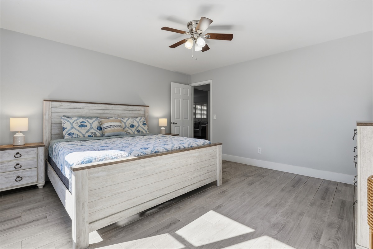 Primary bedroom with king bed- other view