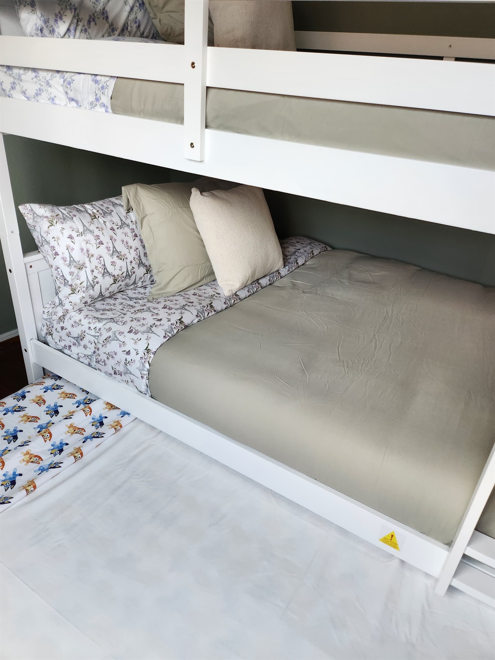 Spacious full-over-full bunk bed with twin trundle (lower bed suitable for toddlers).