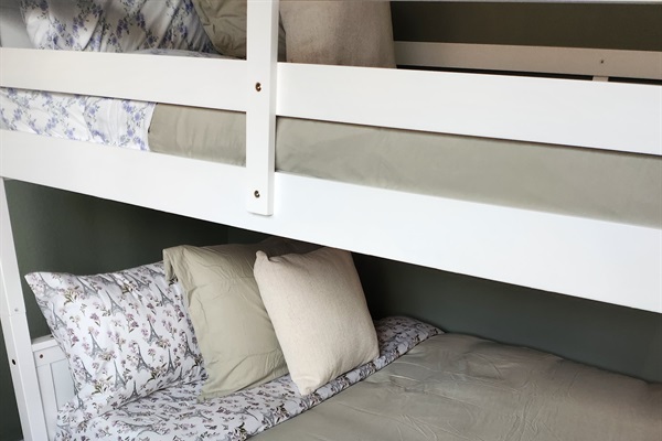 Spacious full-over-full bunk bed with twin trundle (lower bed suitable for toddlers).