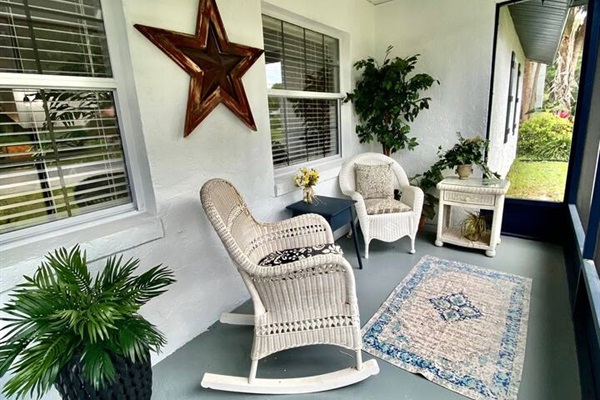 Enjoy the peace and quiet on the front screened porch.
