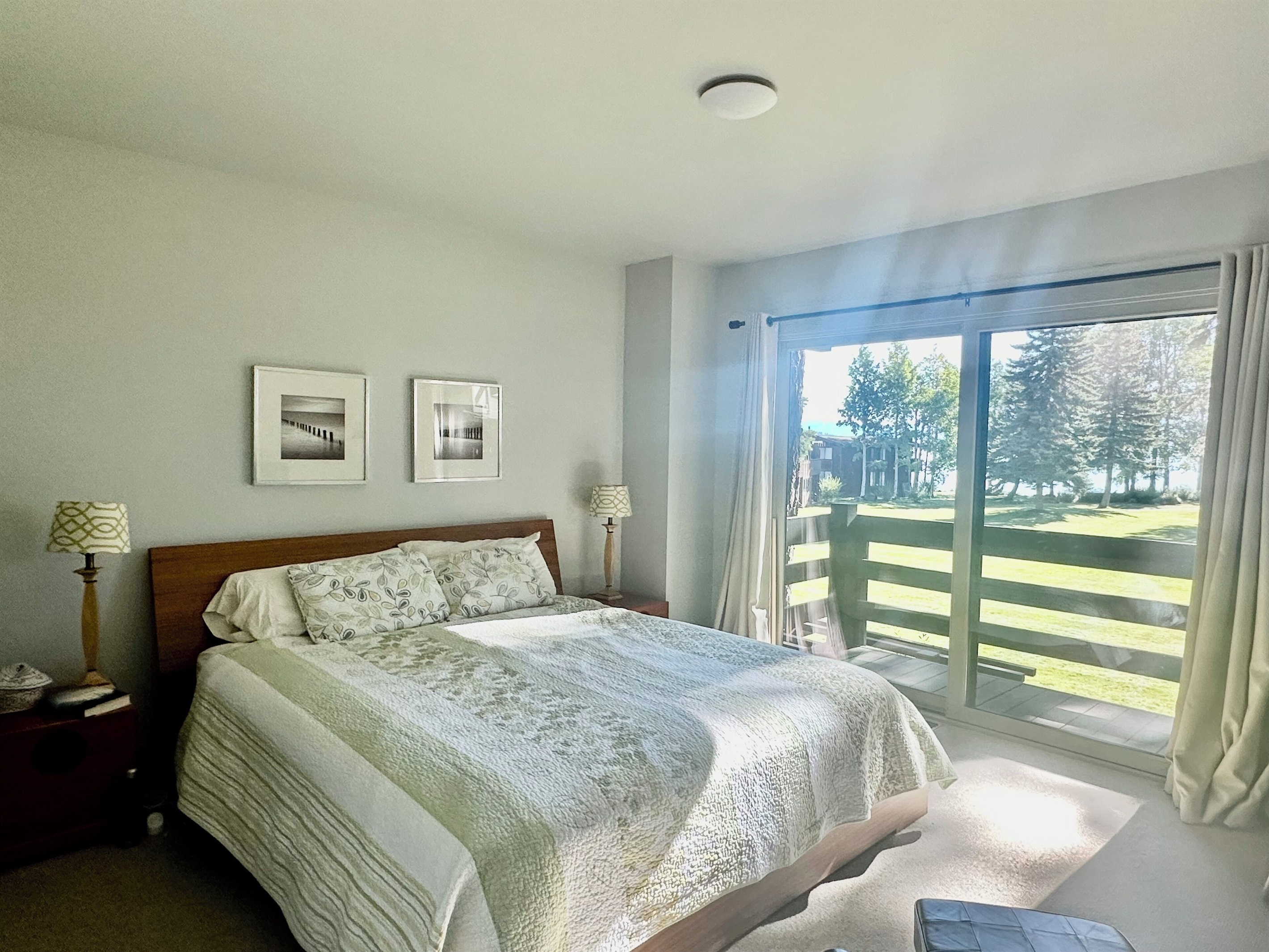 Master bedroom has California king bed and lake facing balcony
