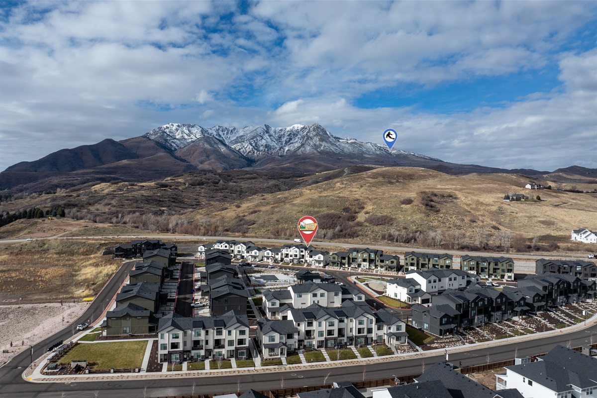 Aerial view showcasing proximity to mountains and recreation.