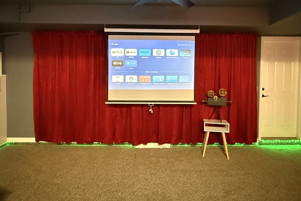 Movie room with a large projector screen