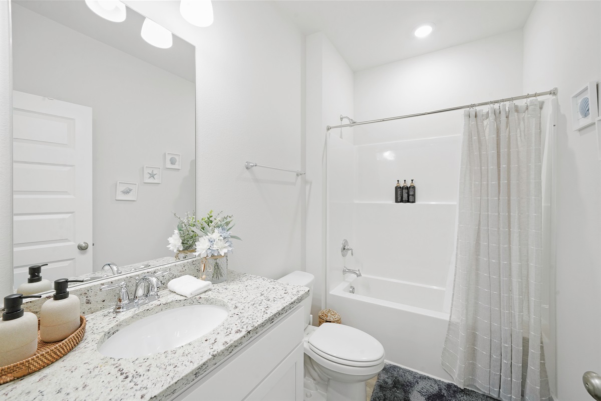 Full bathroom 2: Shower/Tub combo with shampoo, conditioner, and body wash