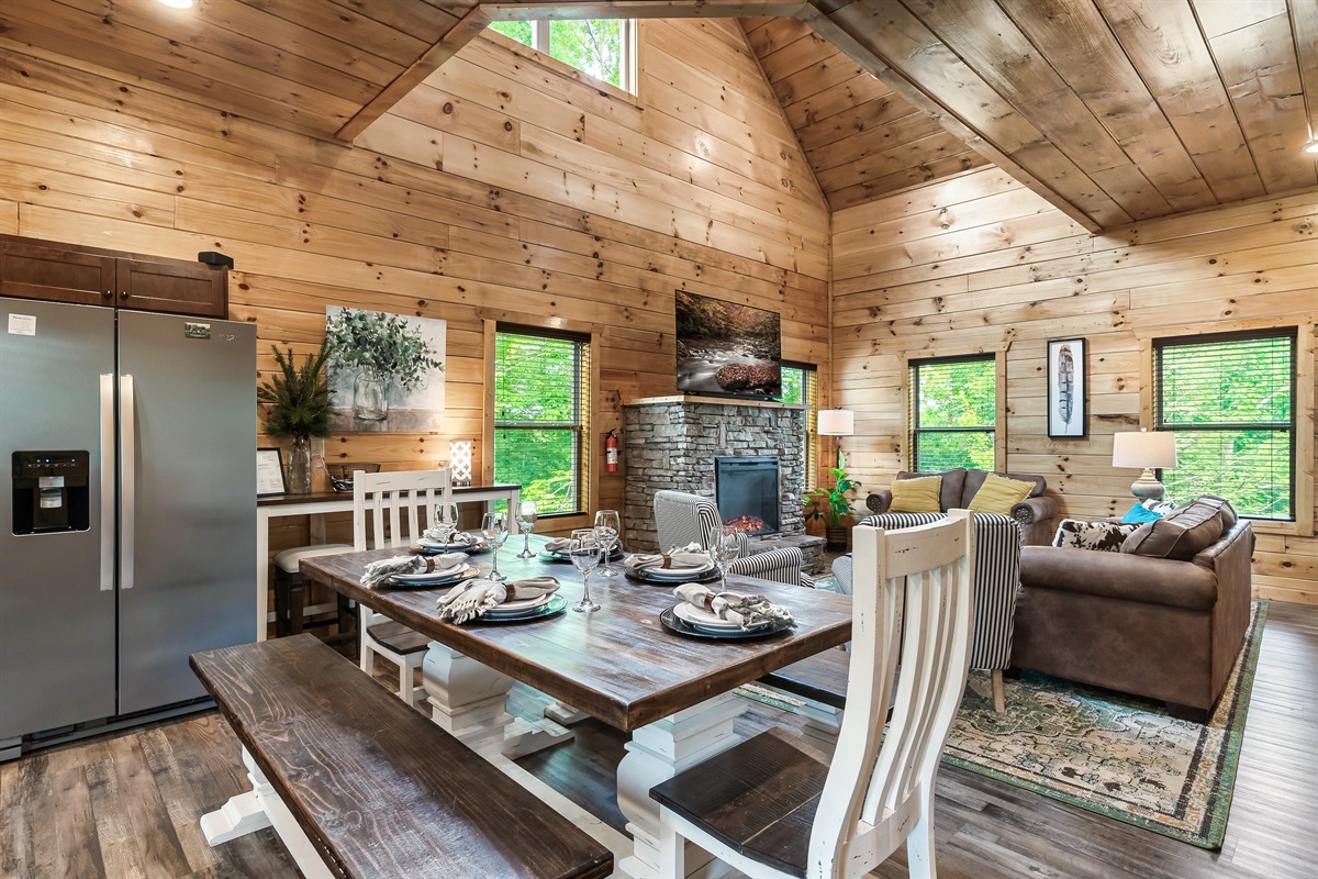 [Dining / Main Level] Table for 6-8 with a bar top for another 3 allows your family to enjoy meals together.