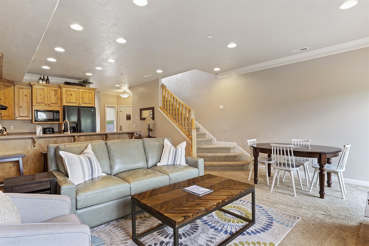 Light-filled main living space designed for gathering, dining, and relaxing together.