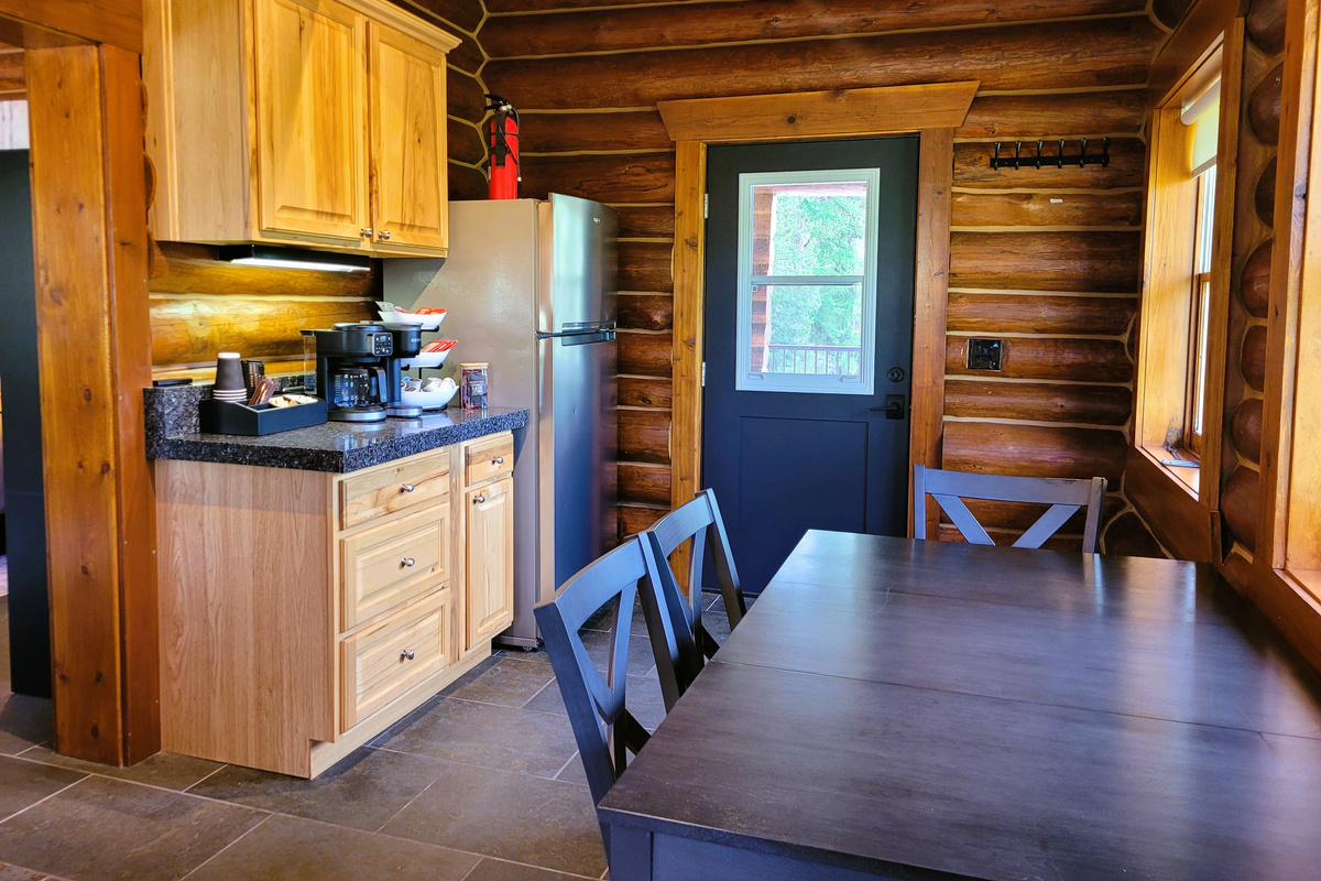 Cozy space to cook and eat, with all the standard kitchen essentials.