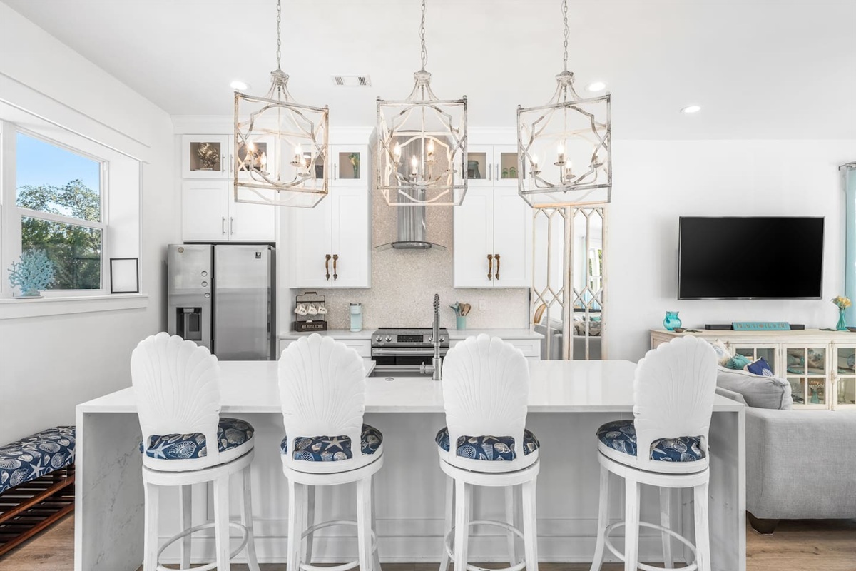 Chef’s kitchen featuring a sleek island, high-end appliances, and a premium coffee station. ☕️ Don't miss the unique seahorse handles imported from Bali!  Coastal luxury meets global style in this Blue Mountain Beach culinary retreat.