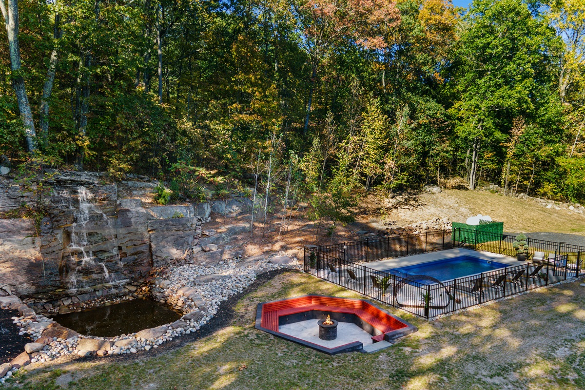 Waterfall with recessed firepit for warm conversations