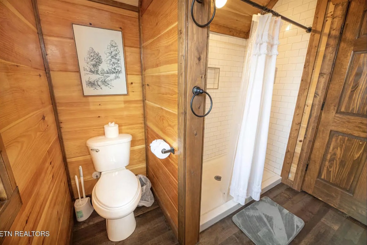 The second full bathroom at Marigold Cabin offers clean, comfortable accommodations for guests throughout the cabin. With three private bathrooms total, this Pigeon Forge vacation rental is perfectly suited for families, friend groups, and multi-generation
