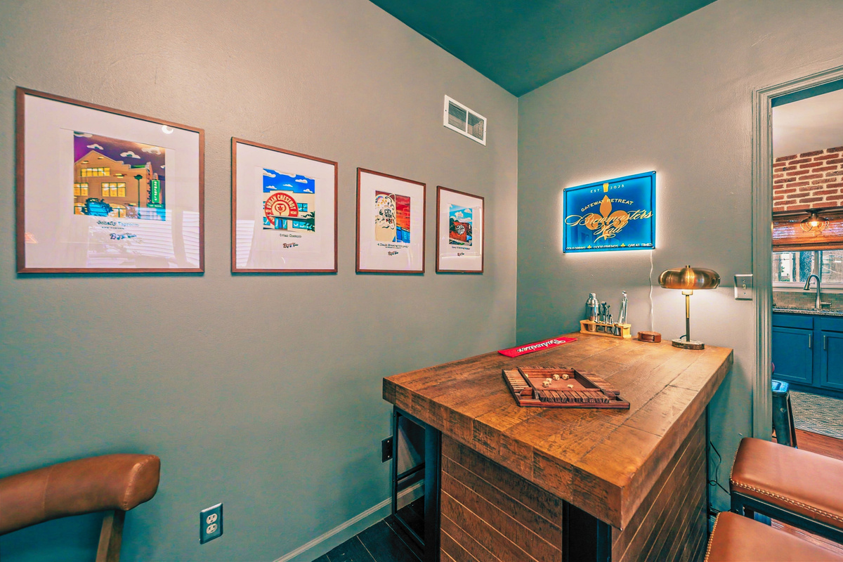 Brewmasters Hall features a rustic wood bar with bartending setup, glassware, cards, and games.