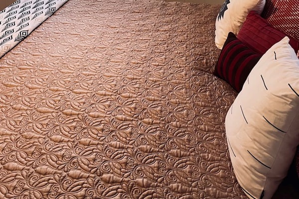 From the master bedroom, the window frames a serene view of the lake, bringing natural calm and a peaceful connection to the outdoors into the room.