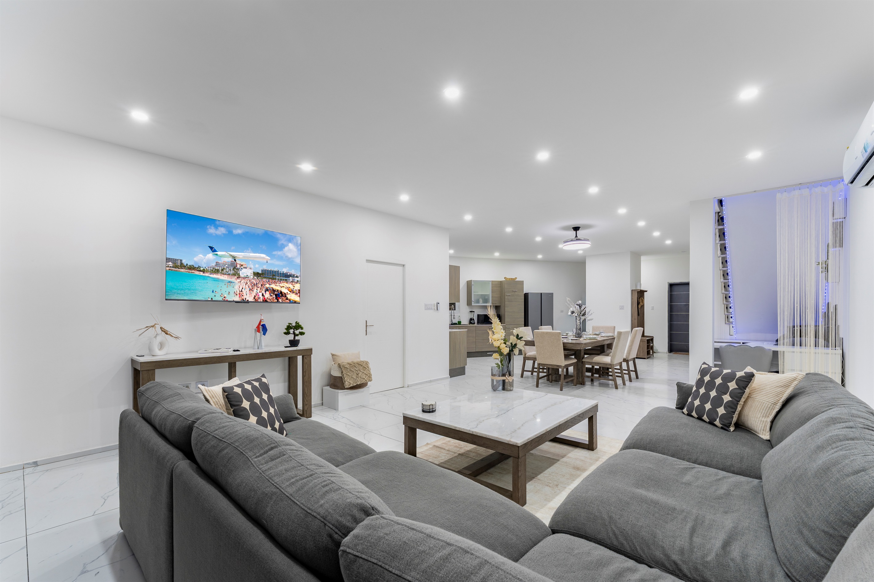 Spacious design connecting the lounge, dining, and chef's kitchen—perfect for entertaining