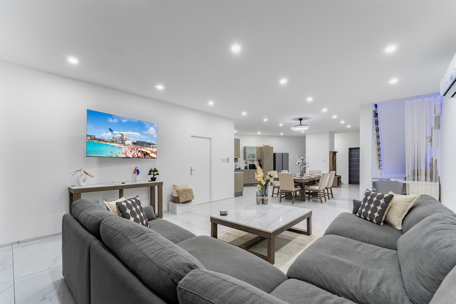 Spacious design connecting the lounge, dining, and chef's kitchen—perfect for entertaining