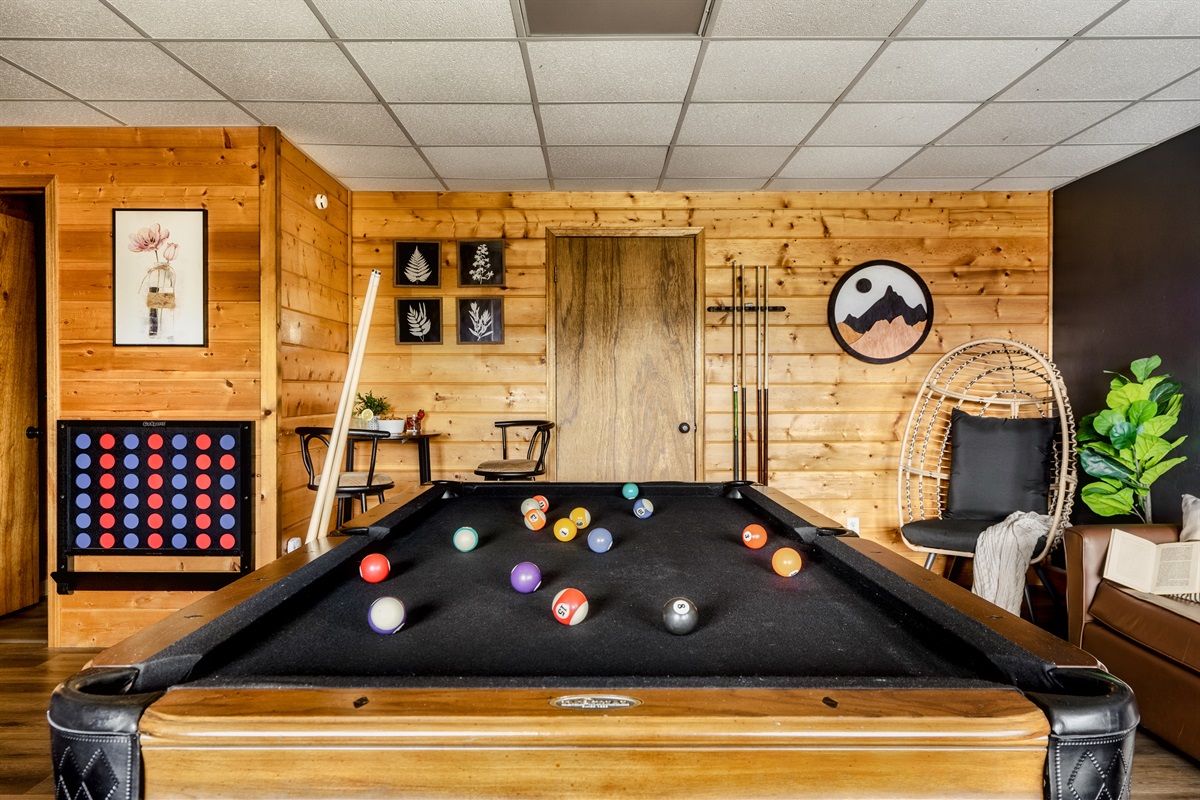 This stylish game room, where a pool table is perfect for gatherings and friendly competitions.