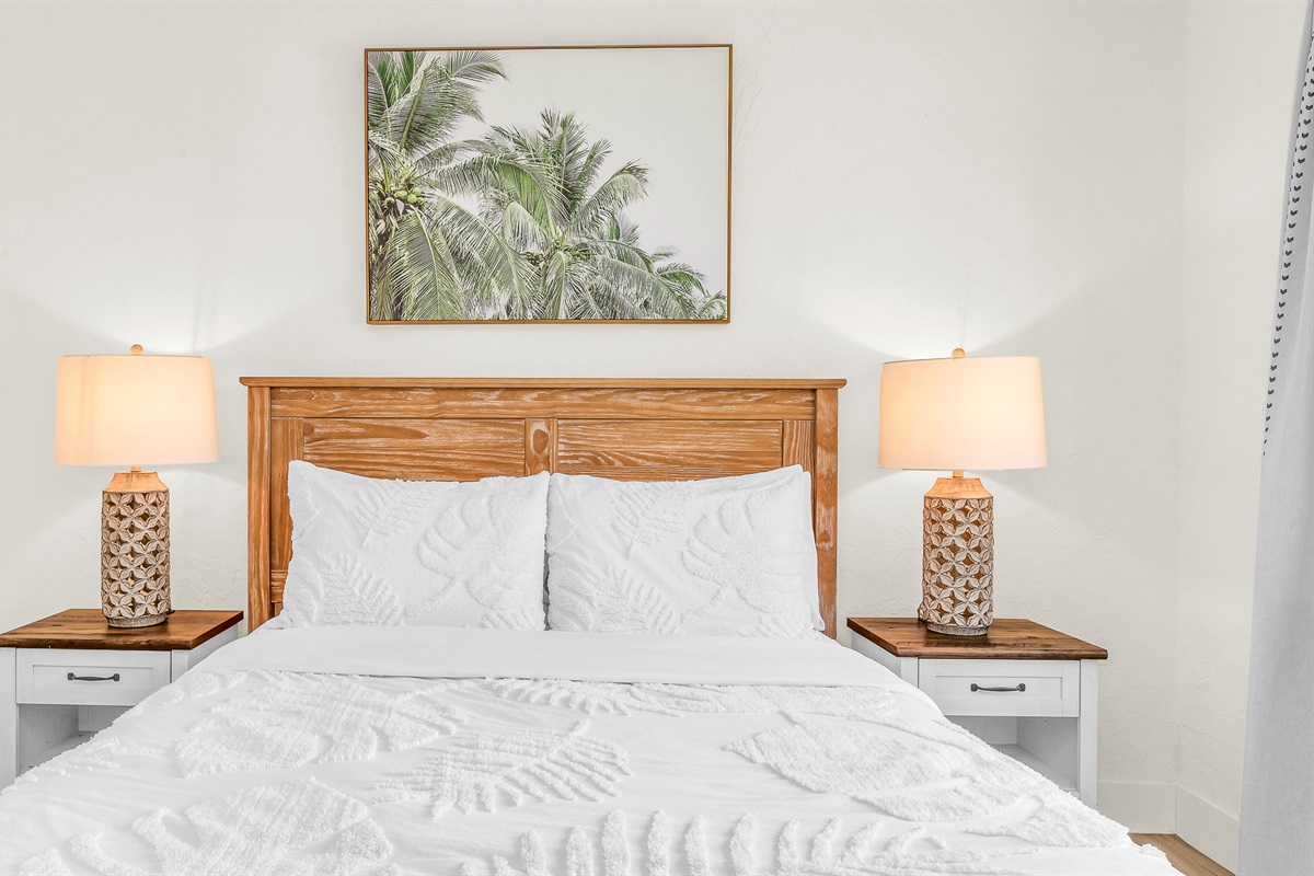 Bedroom 2 offers a relaxing coastal vibe with crisp linens, warm natural light and elegant decor- perfect for guests seeking comfort and tranquility after a day in paradise