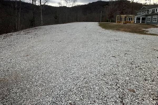 More parking and to the right is down to garage.