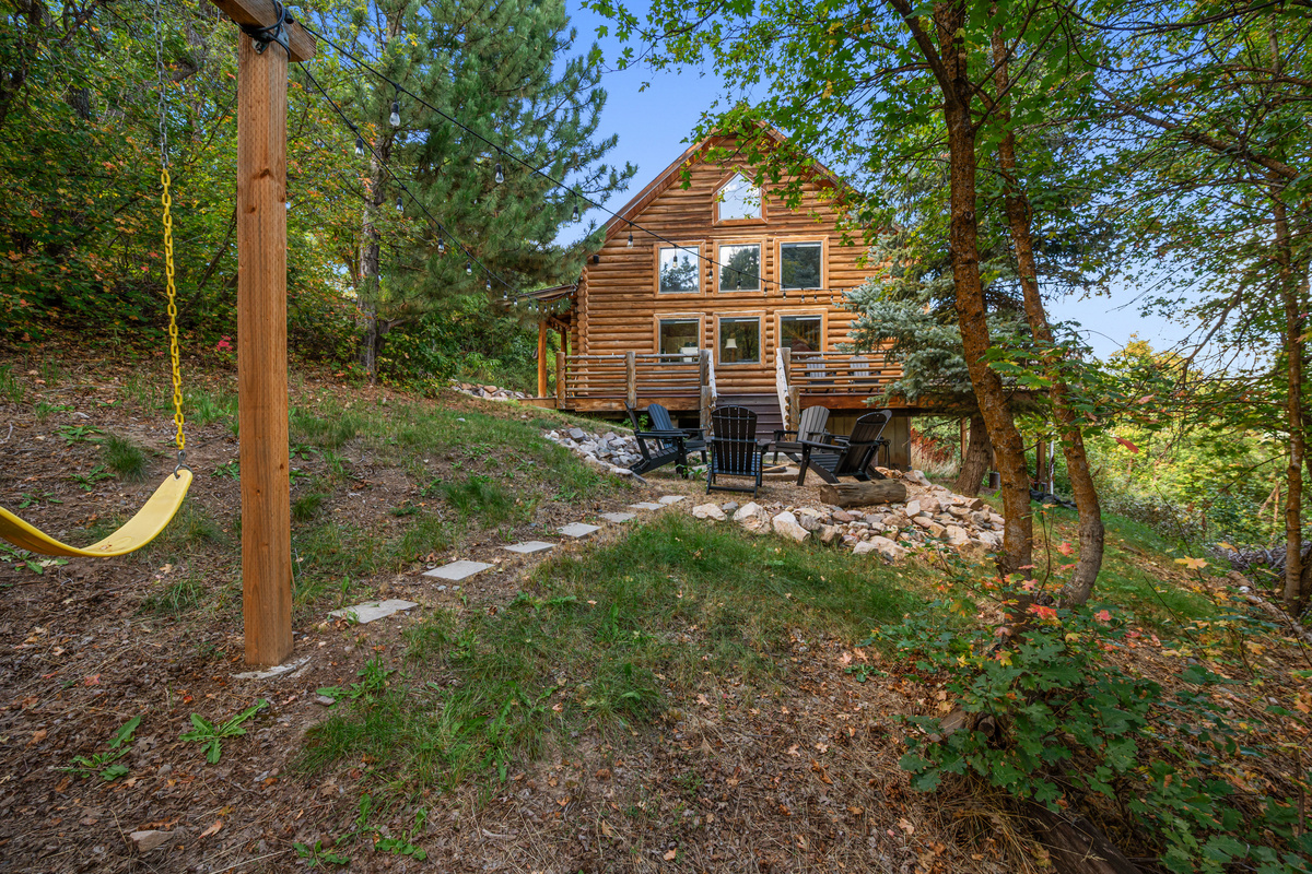 Exterior view of Nordic by Nature surrounded by trees in its secluded mountain setting.
