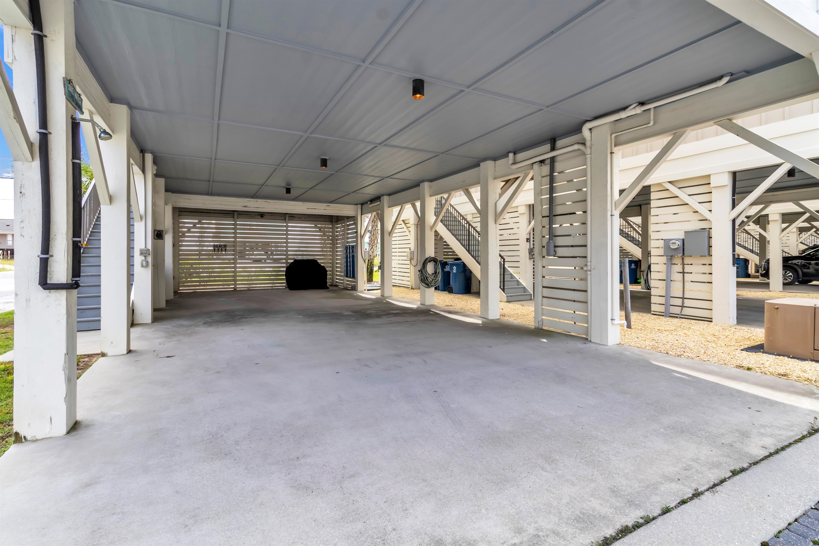 Can easily park 4 vehicles under the house. A large grill is provided for our guests use. The storage closet contains, boogie boards, sand toys,  beach chairs, and a beach umbrella. The beach equipment is all on the honor system. 