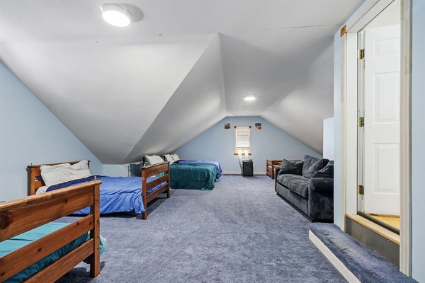 The ultimate group sleeping space - this oversized bunk room comfortably sleeps up to 10 guests and features six beds, plush carpeting, fresh updates, and a private HVAC system for personalized comfort in every season.