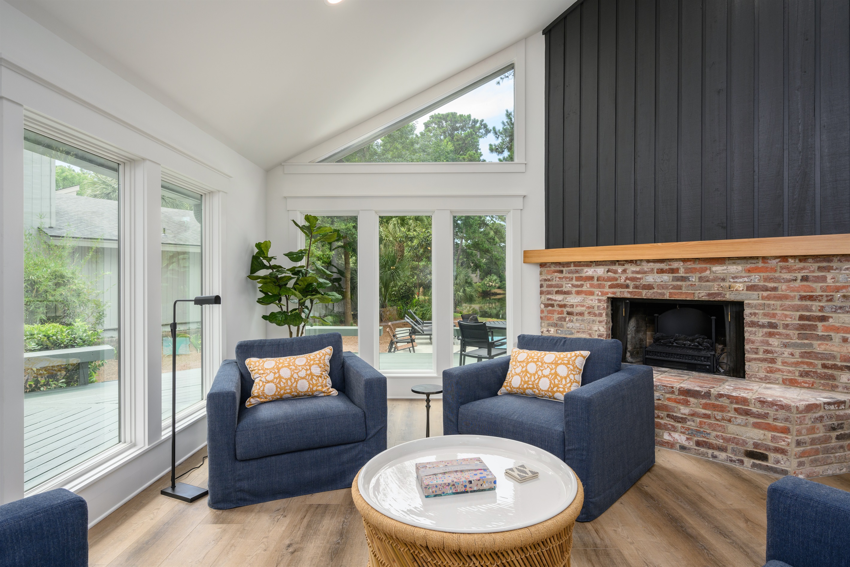 Living room has a fireplace (not for guest use) and you can watch the kids in the pool, too!
