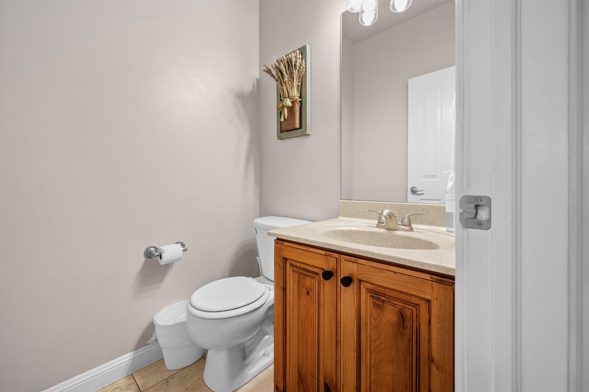 Convenient half bath for guests.