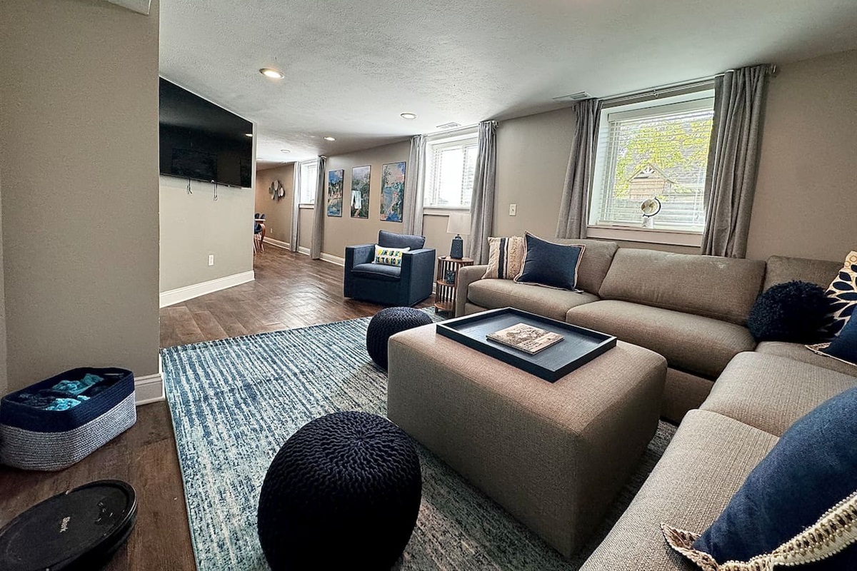 Enjoy a movie night with plenty of comfortable seating and a 65" Roku smart TV.