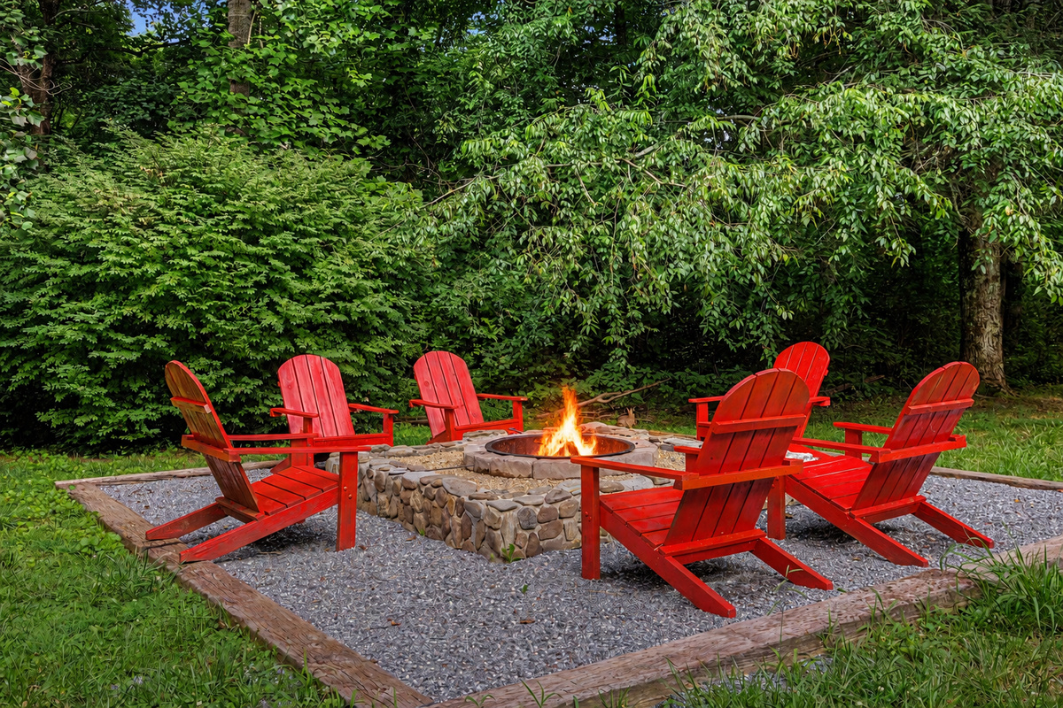 Fire Pit Oasis: Gather around the vibrant red chairs for unforgettable evenings under the stars!