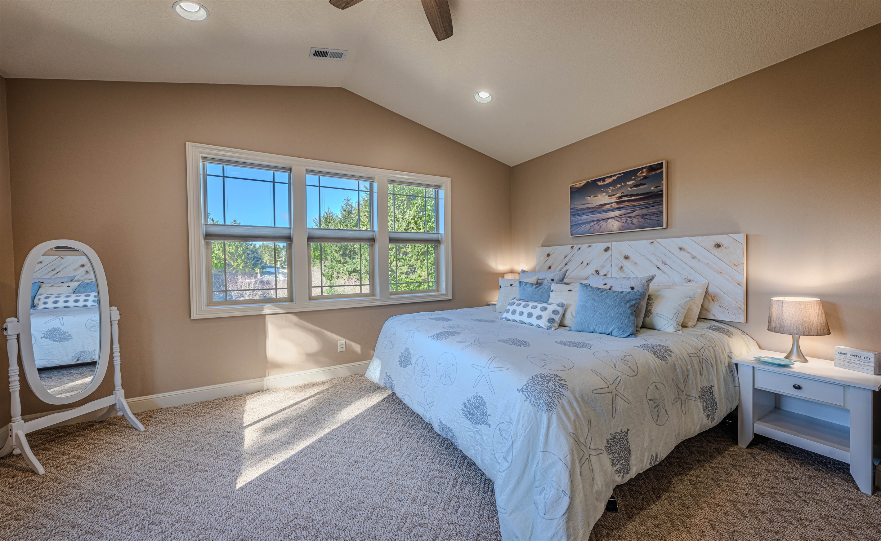 Primary bedroom with King size memory foam mattress and 50" smart TV