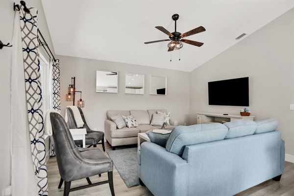 Feel right at home in this comfortable living room.  The living room contains a 58 inch smart TV and the sleeper sofa to allow for 8 guests to sleep in this home.  The sofa sleeper is locked and reservations of 6, 7 or 8 will get the lock combination