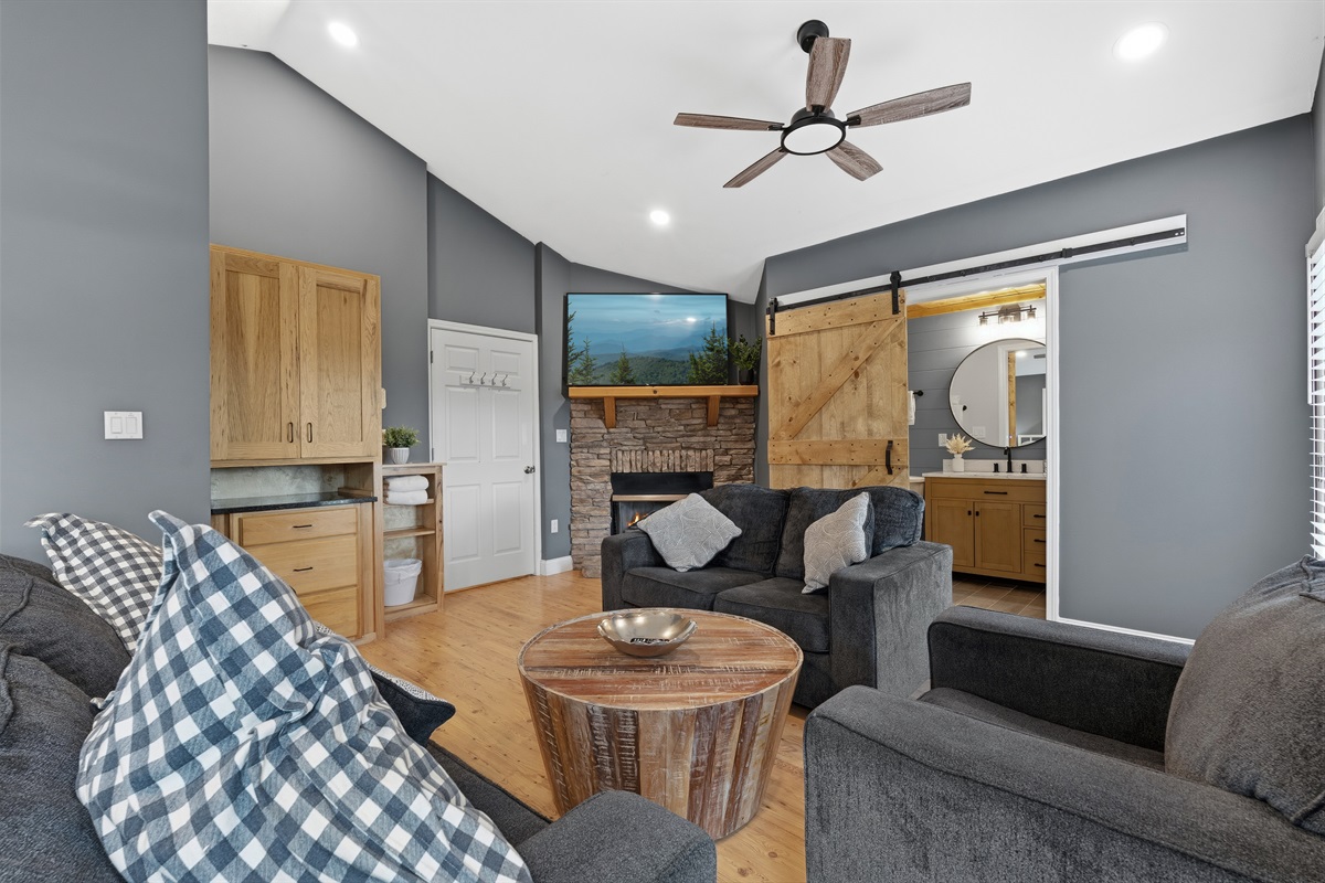 Master bedroom, fire place + reading area (folds out to bed) + king size bed