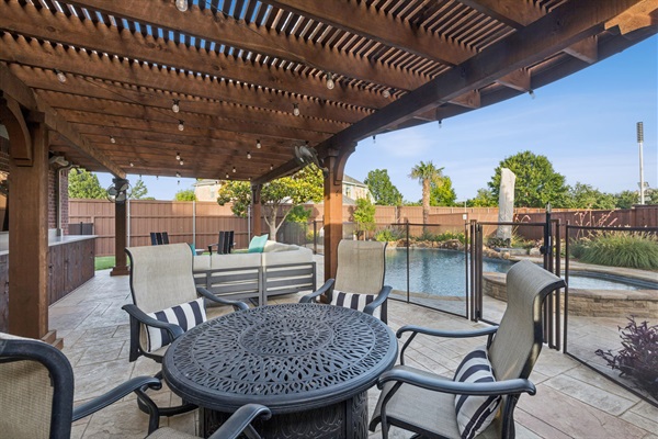 Alfresco dining with a view of your private backyard oasis.