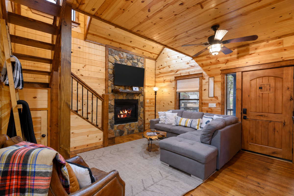 Living Room: Elegant wood accents and a warm fireplace create the perfect retreat after adventure!
