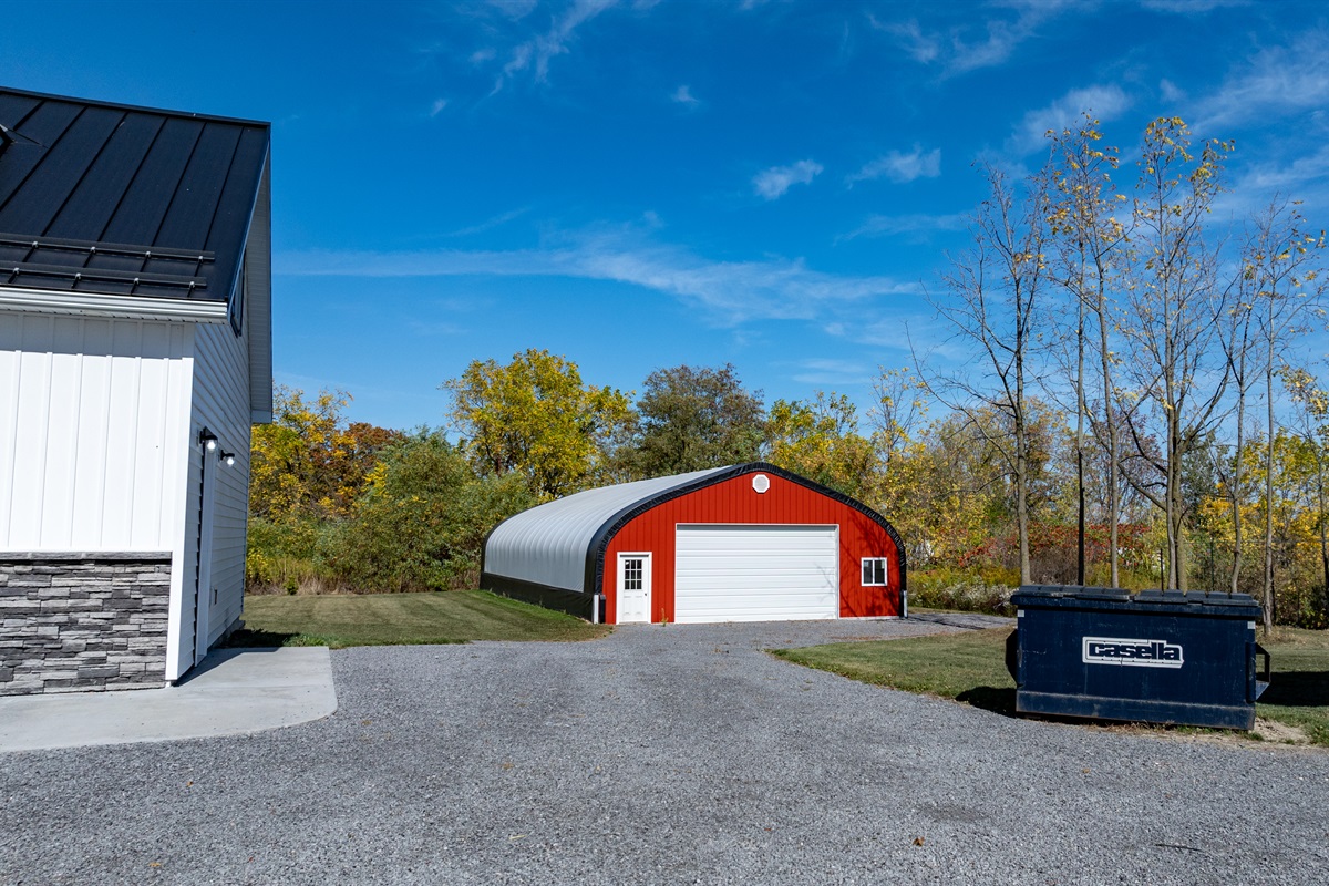 Red barn and white garage — a true countryside setting made for peaceful getaways