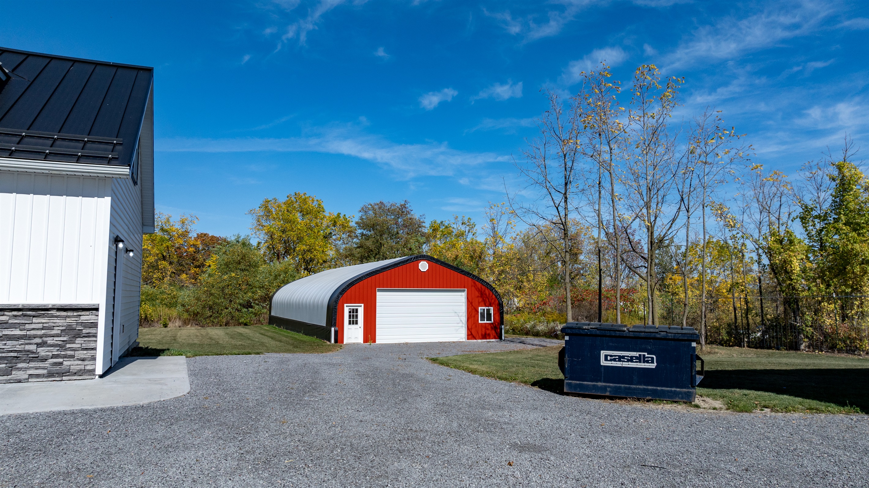 Red barn and white garage — a true countryside setting made for peaceful getaways