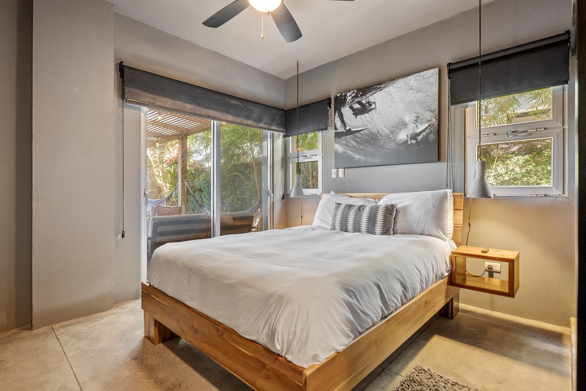 Bright bedroom with a cozy mattress and fresh linens.