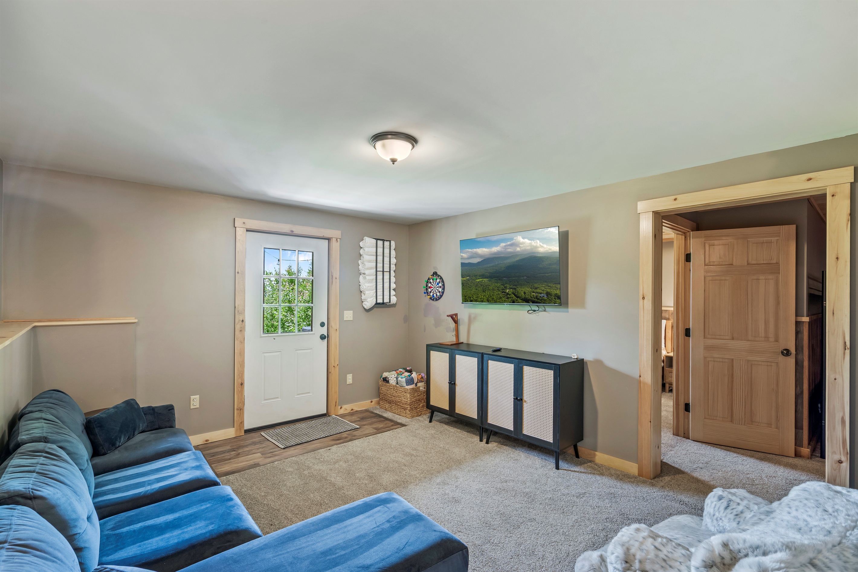 Movie nights made easy with a warm, inviting lounge area on the lower level.