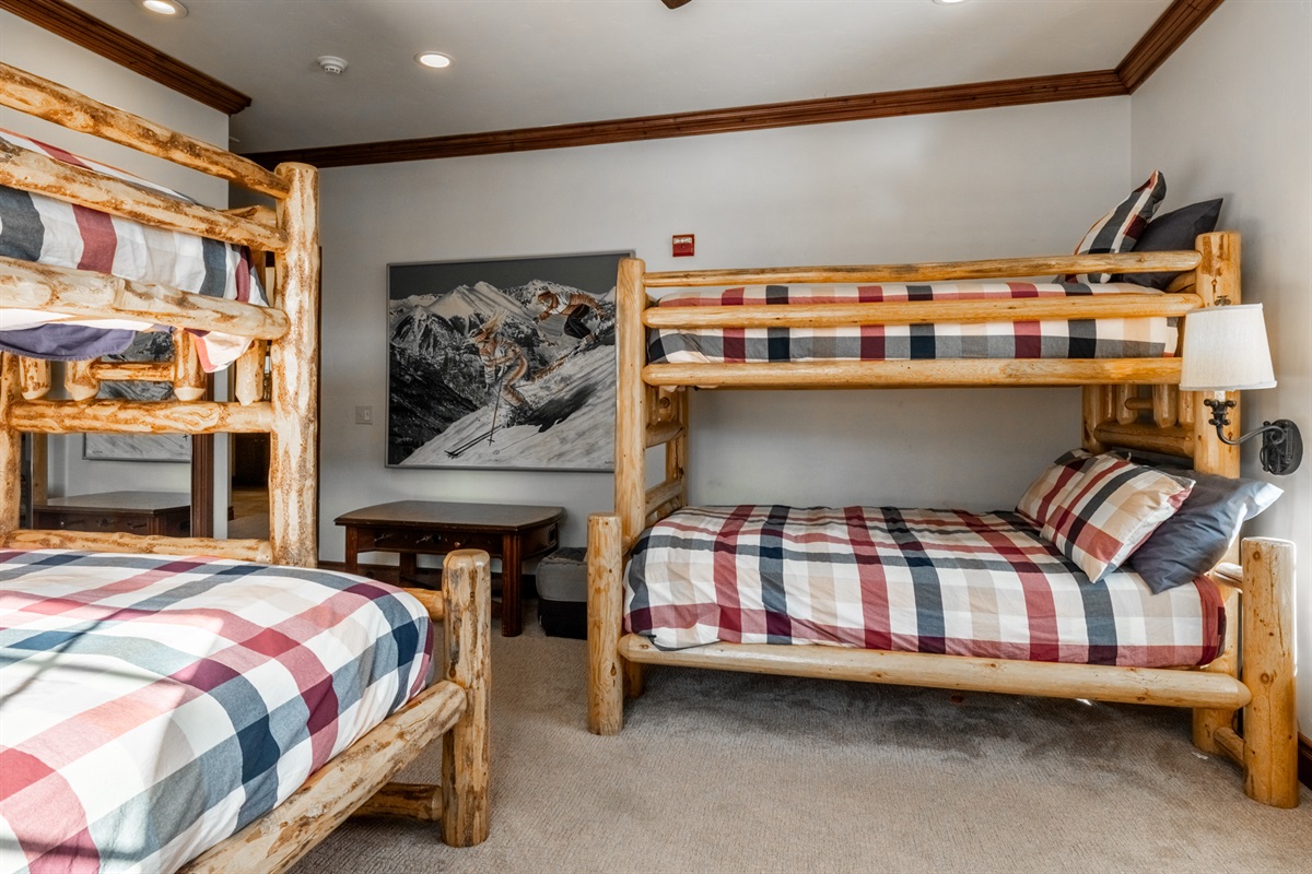 The Refined Retreat bunkroom with retro art can sleep a crowd of kids or adults. (2 twins, full, queen, twin trundle)