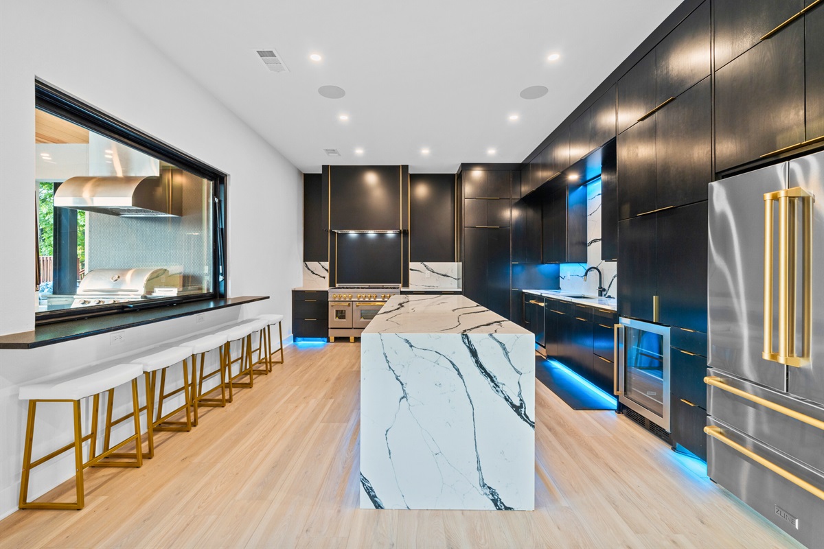 Cooking and entertaining made easy with this indoor-outdoor kitchen setup. Delicious meals await