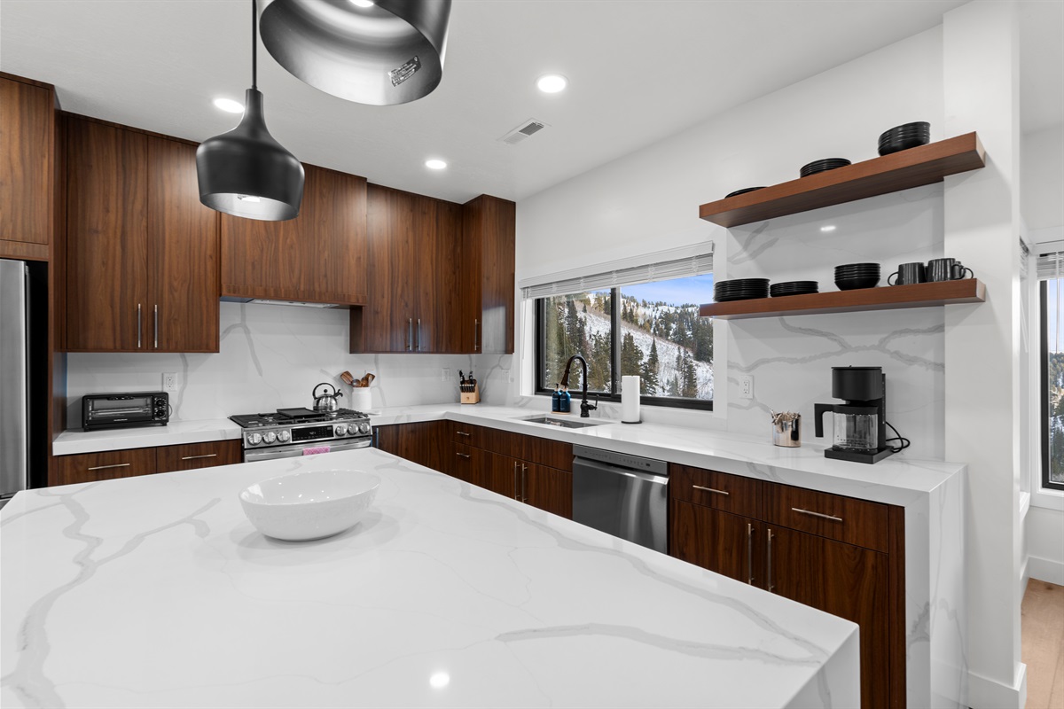 Bright, stylish kitchen with open shelving and premium details.