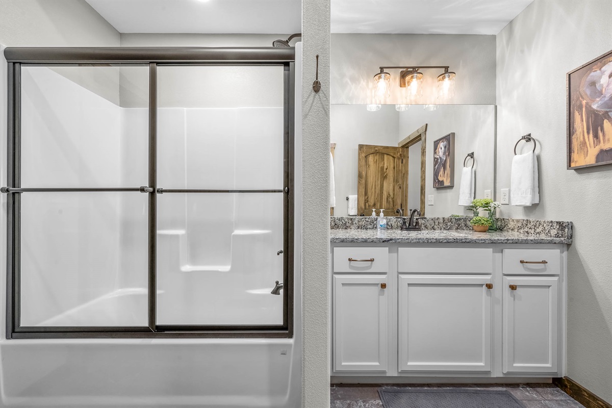 Lower level Jack and Jill bathroom connecting one King bedroom #3 and the game room/sleeper sofa room